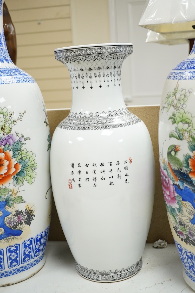 A large pair of Chinese polychrome vases, 60cm high, a pair of famille rose vases, a blue and white brushpot and two other vases (7).